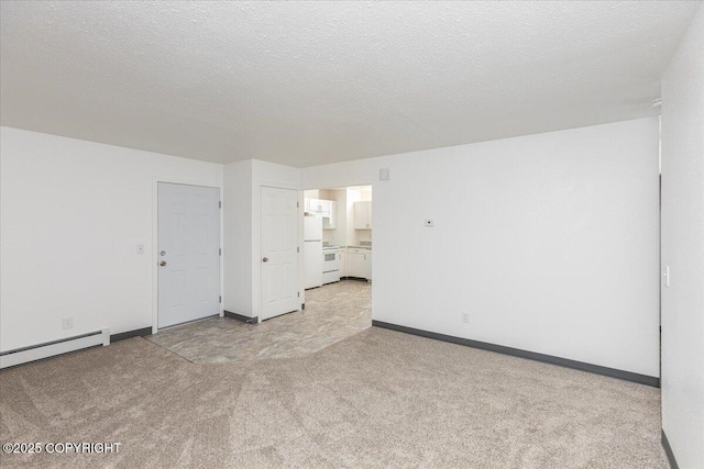 unfurnished room with a baseboard radiator, baseboards, a textured ceiling, and light colored carpet