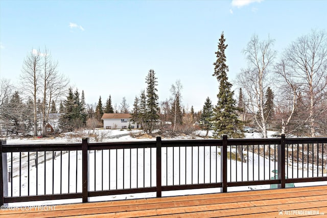 view of snow covered deck