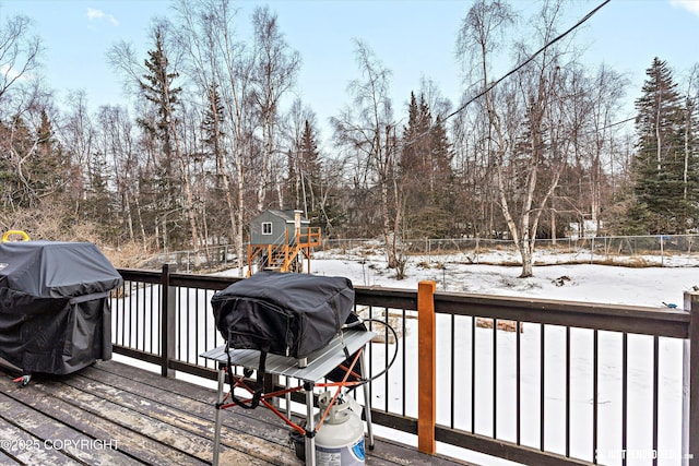 snow covered deck with grilling area