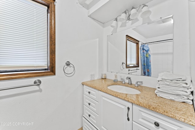 full bathroom featuring curtained shower and vanity