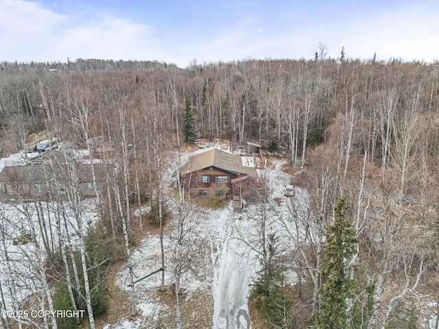 birds eye view of property with a view of trees