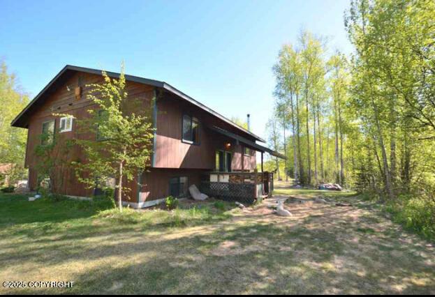 view of side of home featuring a deck