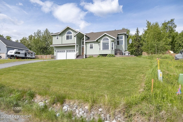 1968 S Paddock Dr, Wasilla, AK 99654 - view of front of property with a garage, asphalt driveway, a front lawn, and roof with shingles