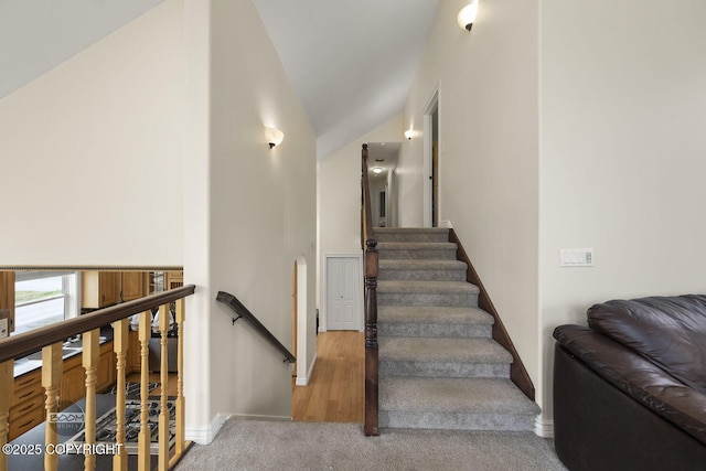 1968 S Paddock Dr, Wasilla, AK 99654 - staircase featuring vaulted ceiling, carpet flooring, and baseboards