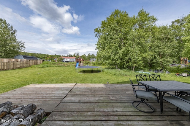 1968 S Paddock Dr, Wasilla, AK 99654 - wooden deck with a trampoline and outdoor dining space