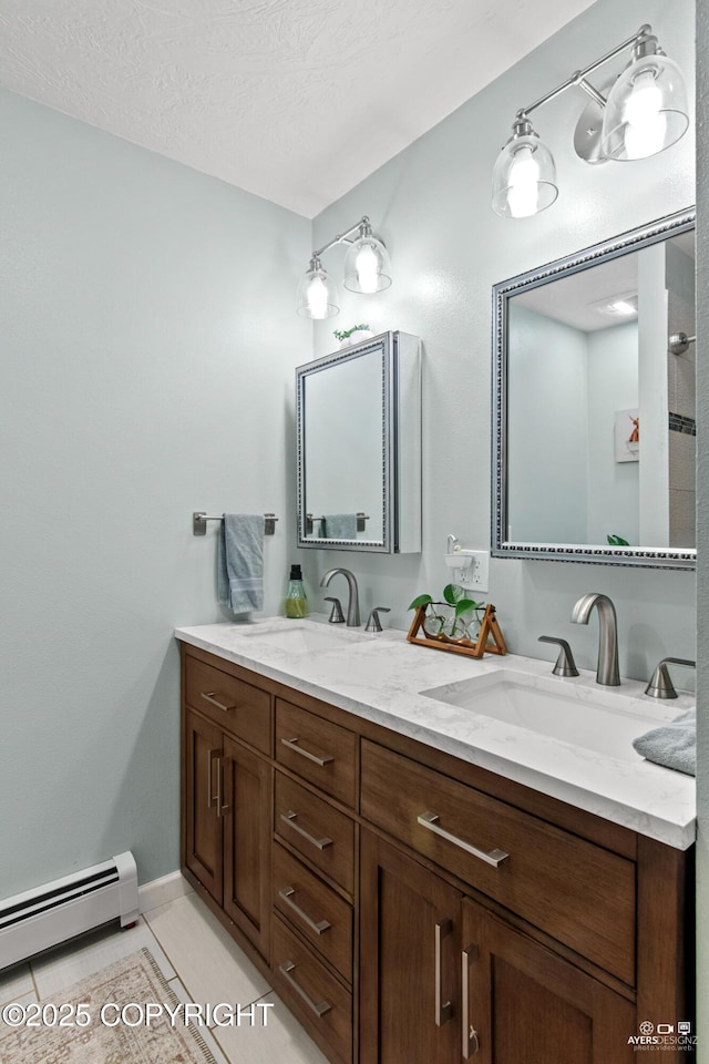 full bathroom featuring double vanity, tile patterned flooring, a baseboard radiator, and a sink