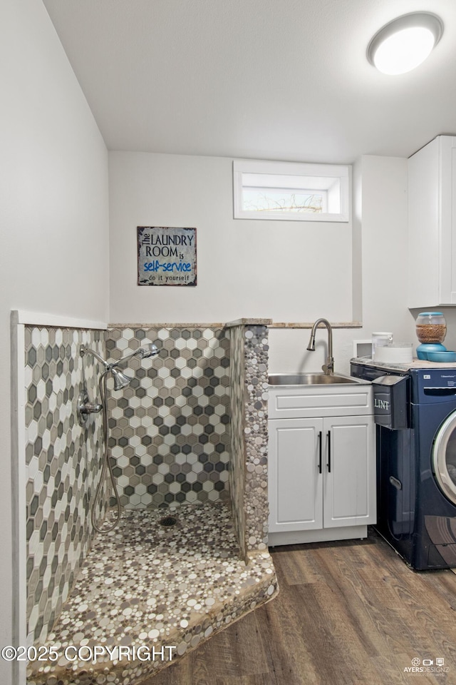 laundry room featuring a sink and dark wood finished floors