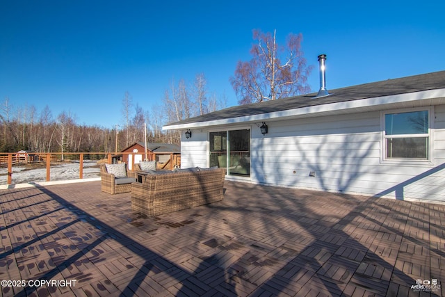 wooden deck with a patio and fence