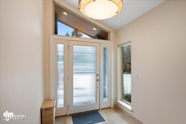 entryway featuring vaulted ceiling