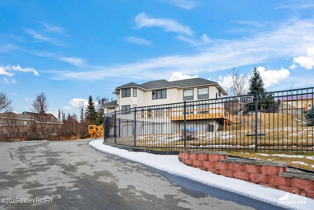 view of front of property featuring fence