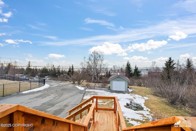 view of yard featuring an outbuilding and fence