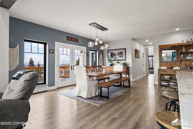 dining space featuring recessed lighting, french doors, baseboards, and wood finished floors