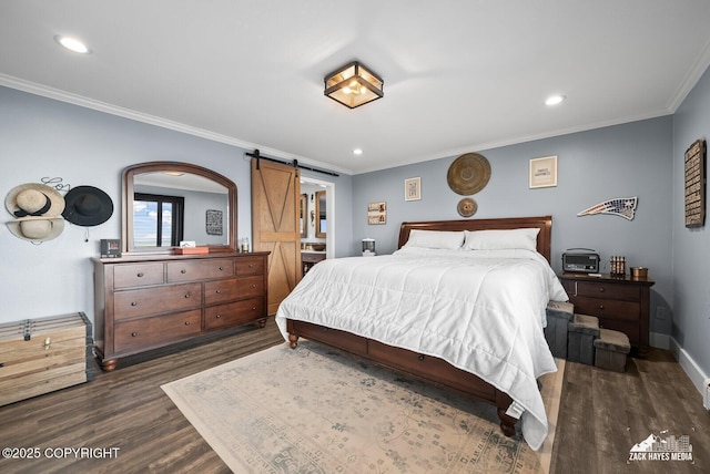 bedroom featuring baseboards, dark wood finished floors, recessed lighting, ornamental molding, and a barn door