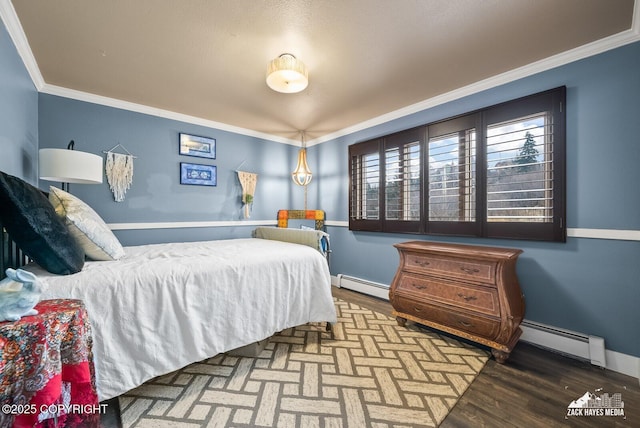 bedroom featuring a baseboard heating unit, baseboards, wood finished floors, and crown molding