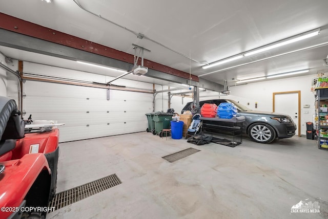 garage featuring a garage door opener