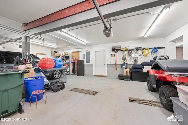 garage with electric panel and a garage door opener