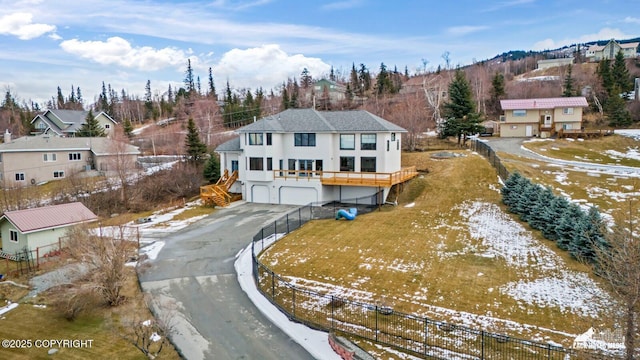 snowy aerial view with a residential view