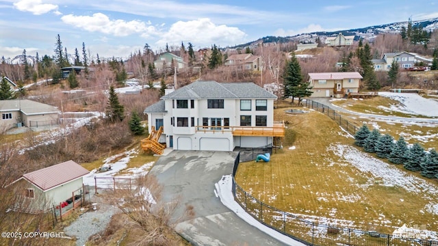 snowy aerial view with a residential view