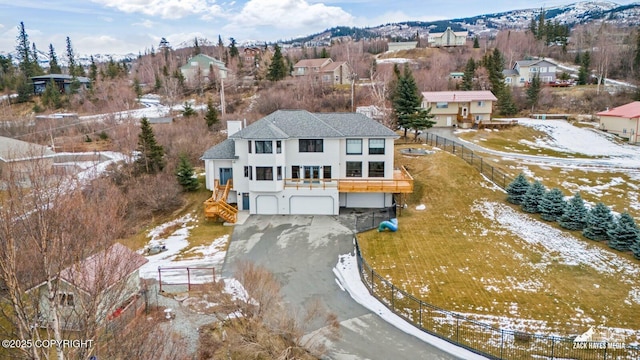 snowy aerial view with a residential view