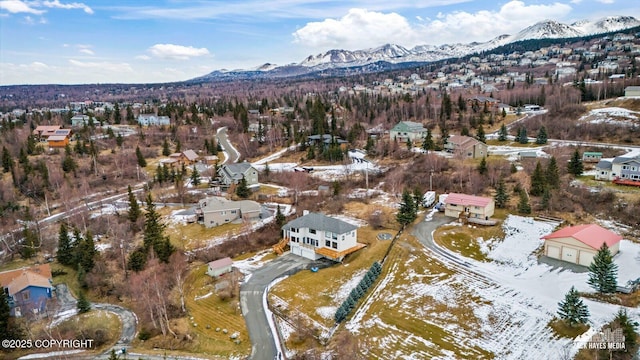 birds eye view of property with a mountain view and a residential view