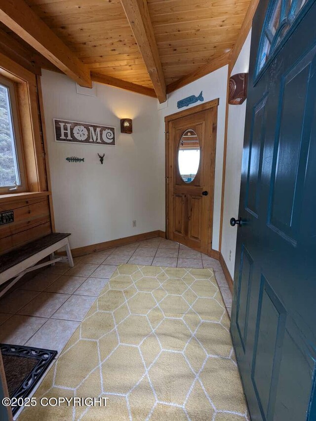 41650 Charlie Dr, Homer, AK 99603 - foyer with light tile patterned floors and a wood ceiling with exposed beams