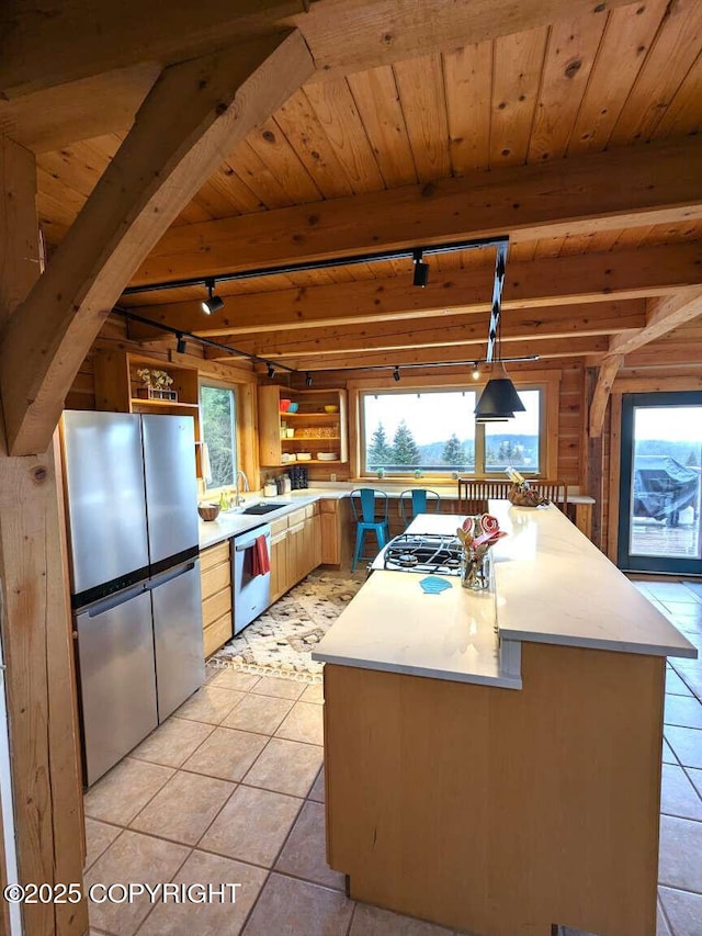 41650 Charlie Dr, Homer, AK 99603 - kitchen with appliances with stainless steel finishes, track lighting, open shelves, a wood ceiling with exposed beams, and light countertops