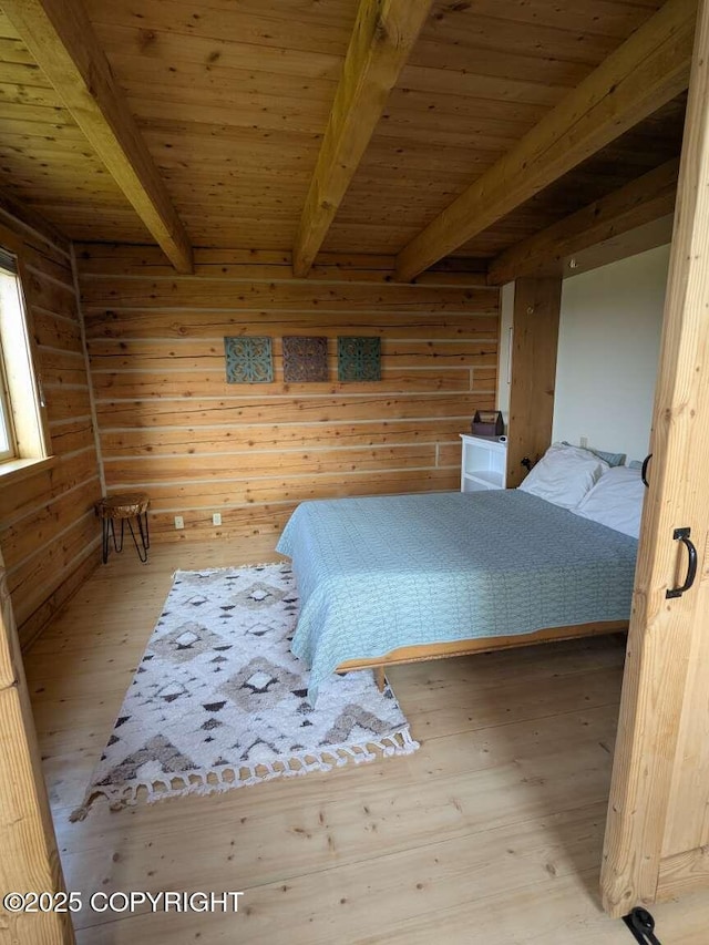 41650 Charlie Dr, Homer, AK 99603 - unfurnished bedroom featuring a wooden ceiling with exposed beams, hardwood / wood-style flooring, and wood walls