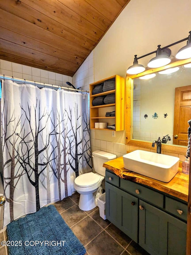 41650 Charlie Dr, Homer, AK 99603 - bathroom featuring lofted ceiling, wood ceiling, vanity, tile patterned flooring, and a shower with shower curtain
