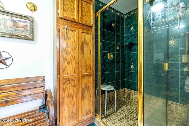 full bath with a shower stall