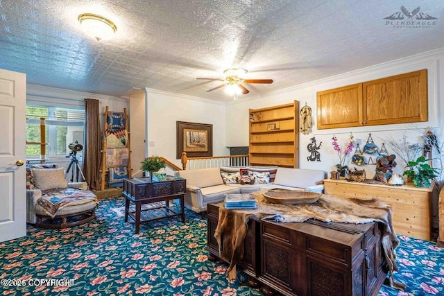 living area featuring ornamental molding, carpet flooring, a textured ceiling, and a ceiling fan