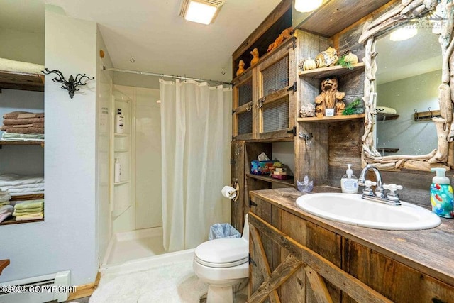 full bathroom with vanity, baseboard heating, a shower stall, and toilet