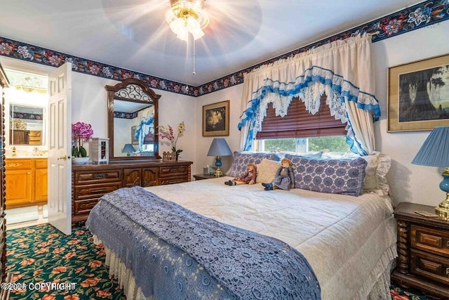 carpeted bedroom featuring a ceiling fan