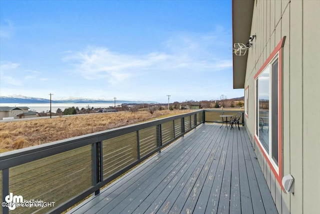 wooden terrace with a water view