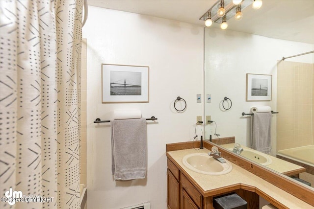 full bathroom featuring shower / bathtub combination with curtain and vanity