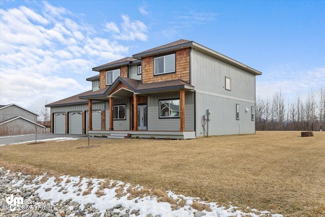 view of front of home with driveway and a front lawn