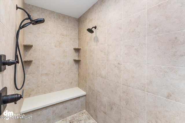 bathroom featuring tiled shower