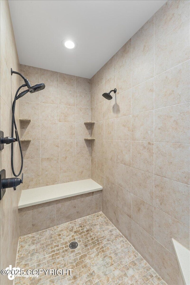 bathroom with tiled shower