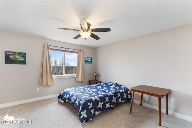 carpeted bedroom featuring ceiling fan and baseboards