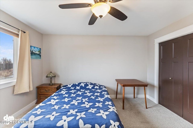 bedroom with carpet floors, baseboards, and a ceiling fan