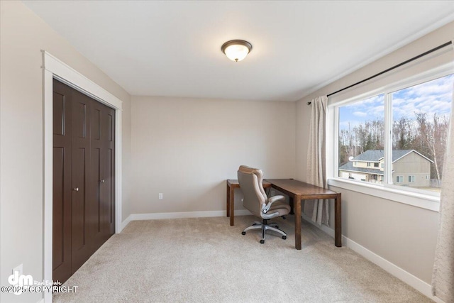 office area featuring carpet floors and baseboards