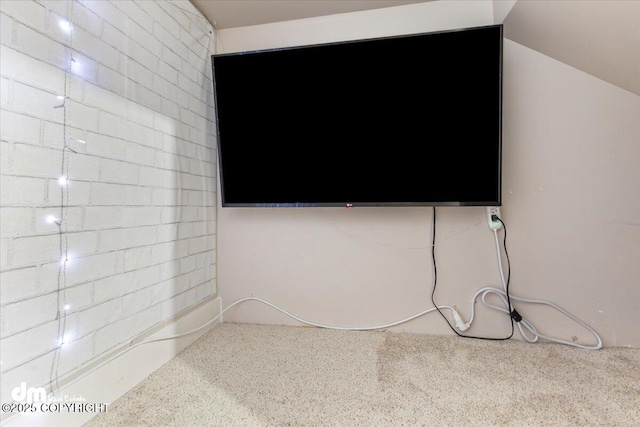 spare room featuring vaulted ceiling