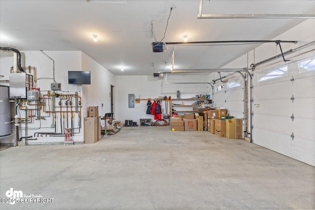 garage featuring electric panel and a garage door opener