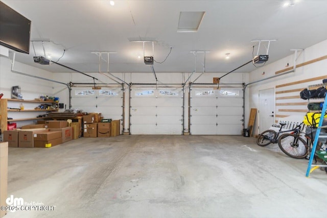 garage featuring a garage door opener