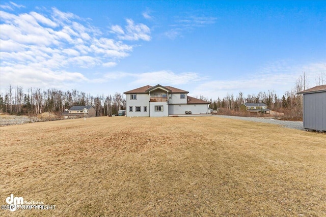 rear view of house with a lawn