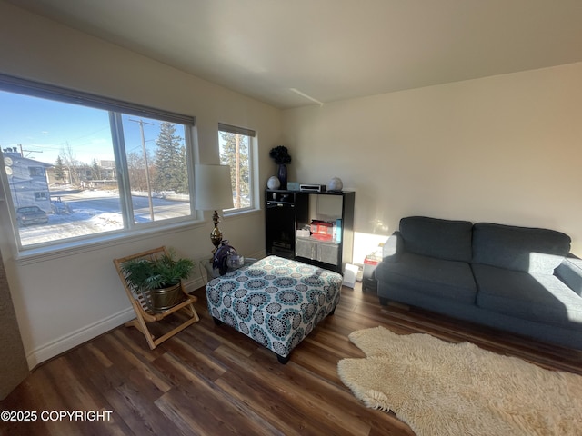 living room with dark wood-style floors and baseboards