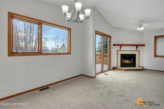 unfurnished living room with a tiled fireplace, carpet flooring, visible vents, and baseboards