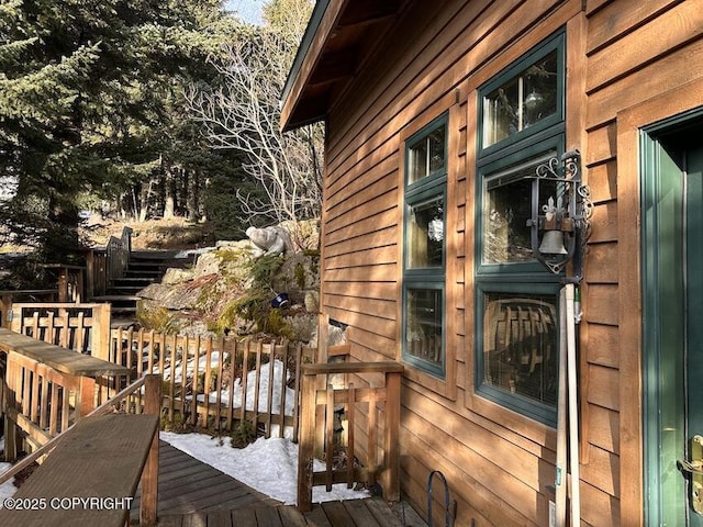 view of home's exterior featuring a wooden deck