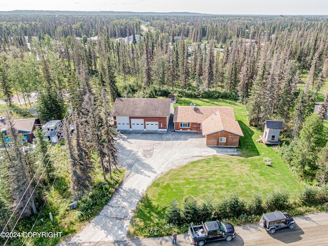 bird's eye view featuring a wooded view