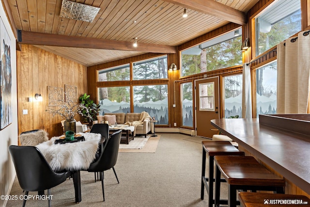 interior space with a wealth of natural light, wooden ceiling, and lofted ceiling with beams