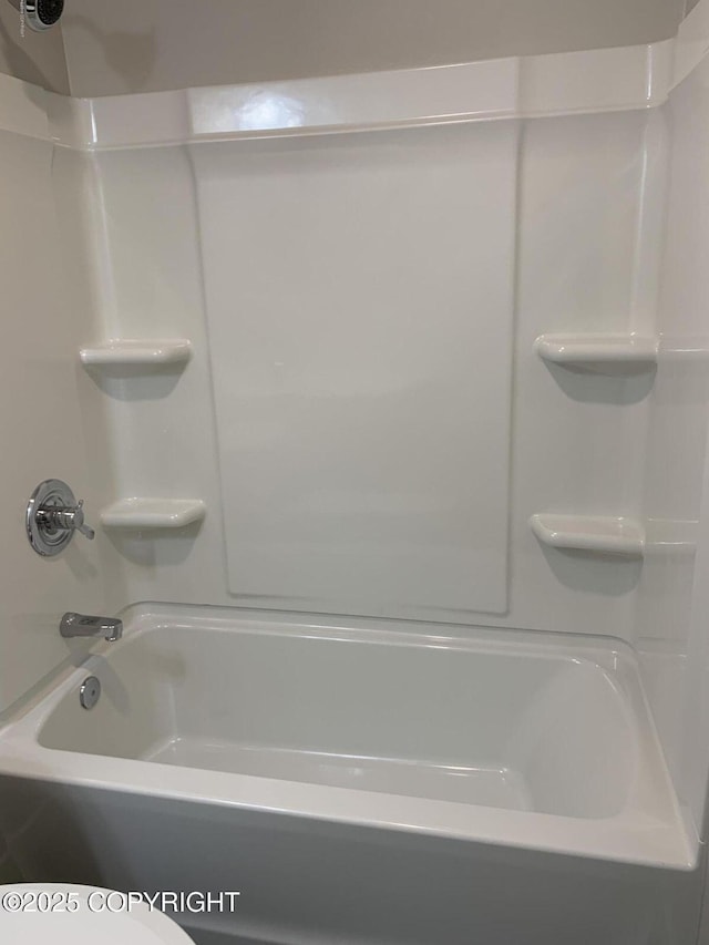 bathroom with shower / tub combination